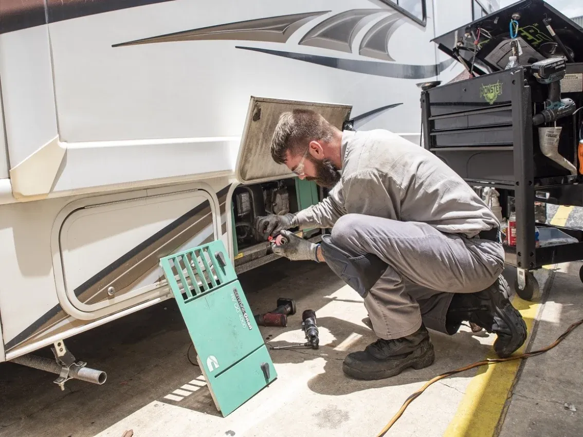 RV onboard generator being serviced during a mobile repair visit in the East Valley