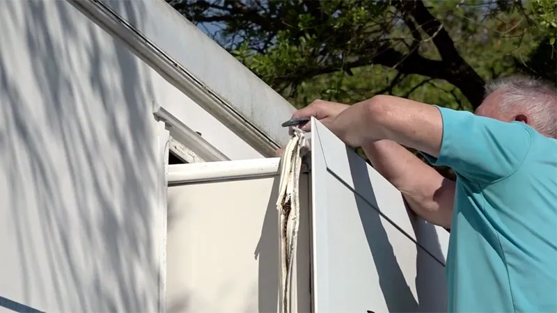 RV slide-out mechanism being repaired during a mobile visit in the East Valley